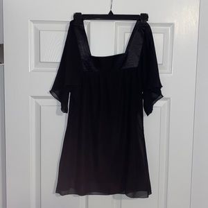 Womens Black top with satin accent and sheer sleeves.